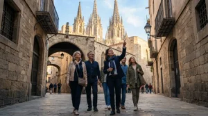 A local guide shows a small private group the Gothic Quarter in Barcelona