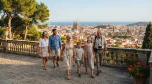 A multi-generational family enjoying private tours for families in Barcelona while overlooking the sunny city skyline.