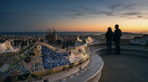 The mosaic bench terrace at Park Guell at sunset, looking out over Barcelona